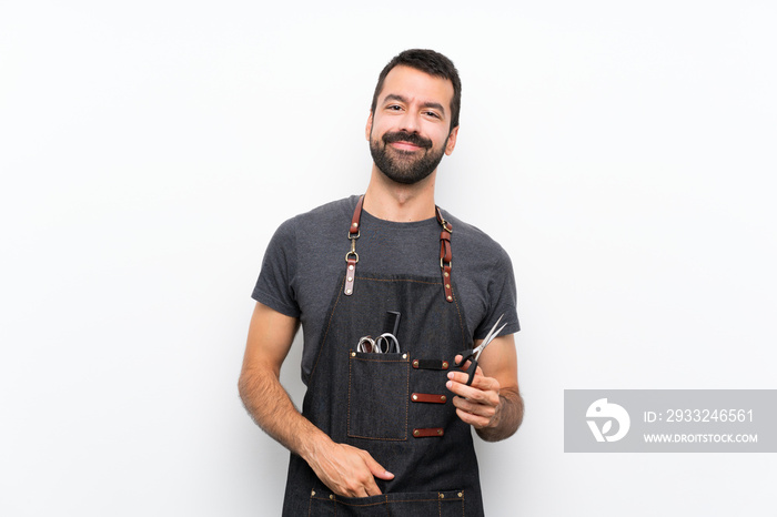 Barber man in an apron laughing