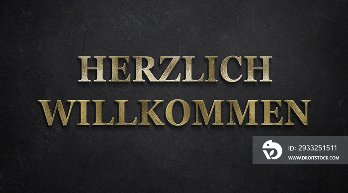 Goldener Schriftzug  Herzlich Willkommen  auf schwarzem Papier-Untergrund