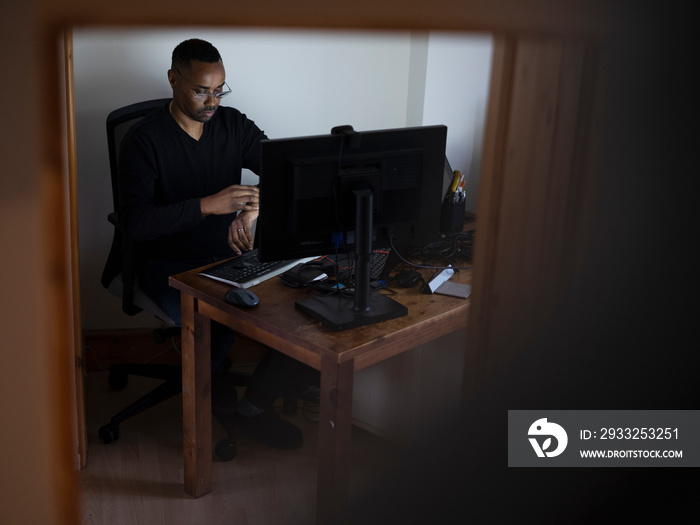 Man working on computer at home