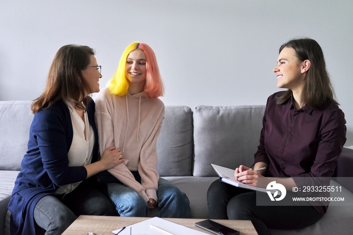 Social worker, psychologist at meeting with mature woman and her teenage daughter