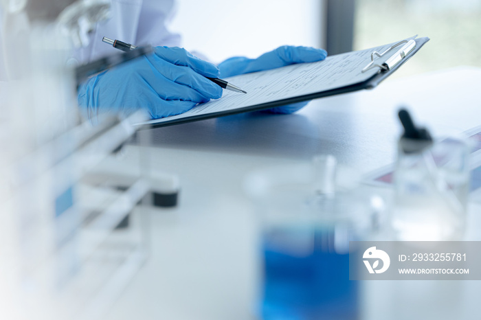 Technician scientists researching biotechnology at laboratory.