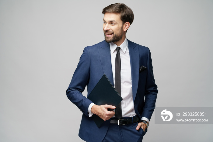 Portrait of a handsome young business man holding document folder