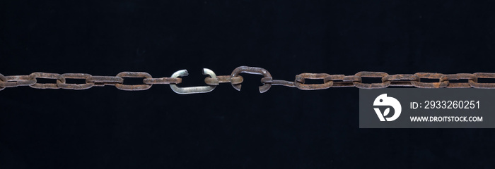 broken link metal chain isolated on black background