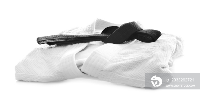 Karate uniform with black belt on white background