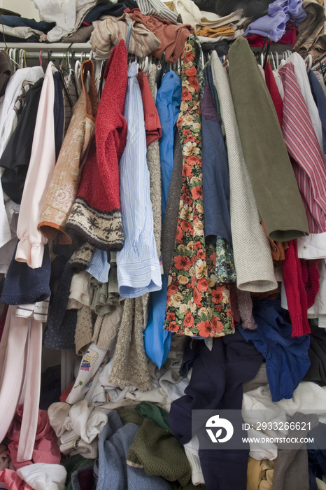 messy closet overfilled with clothes