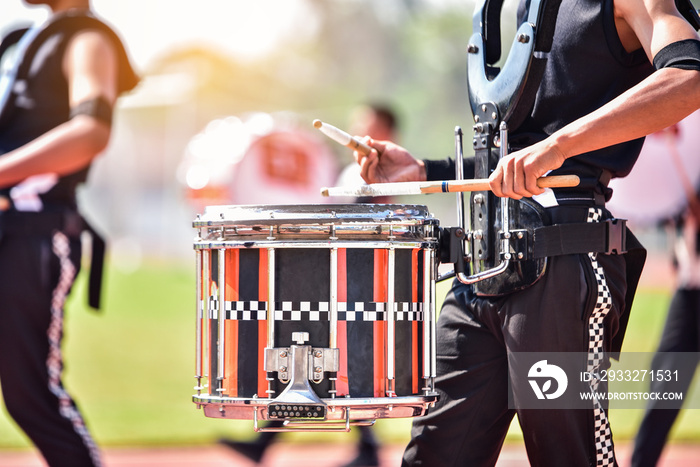 Close-up of marching band drummers marching