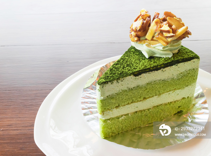 Closeup matcha green tea cake in coffee shop with nature background