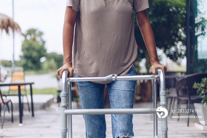 Young women using a walker cane during rehabilitation,medical and orthopedic concept,Healthcare and 