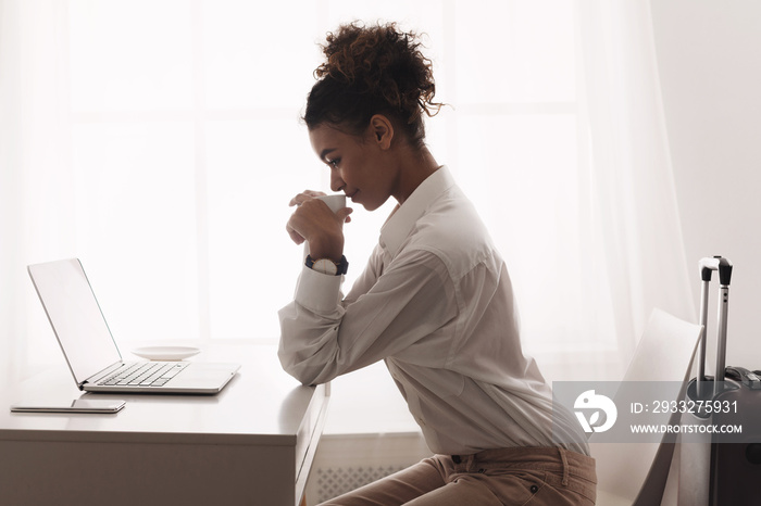 Business travel. Woman planning route on laptop