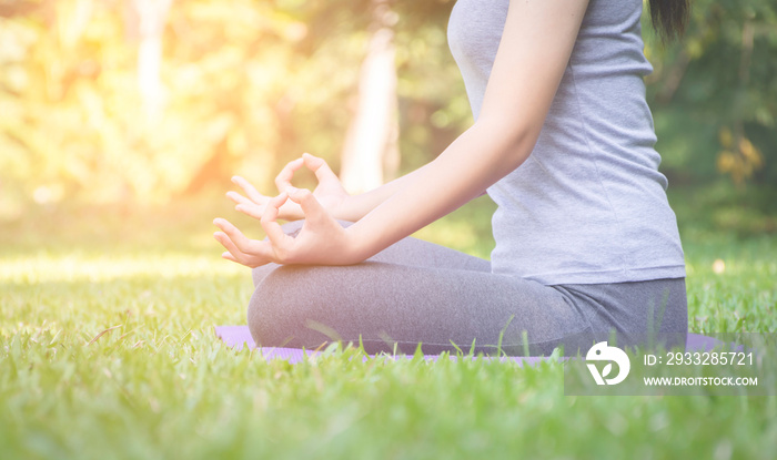 fitness girl practicing yoga in park