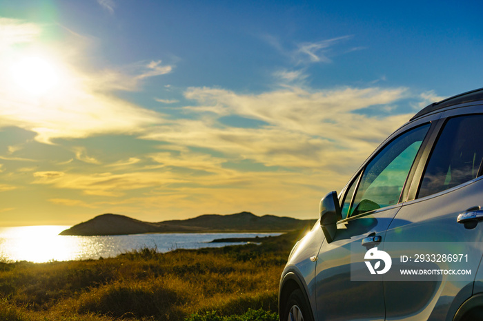 Car parking on seashore in sunset time