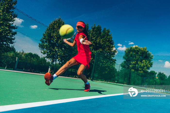 Girl hitting ball. Player on tennis match