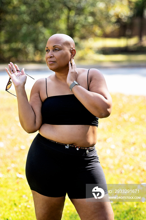 Bald Black woman outside