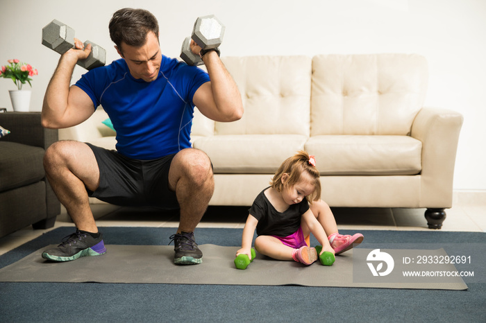 Strong dad impressing her daughter