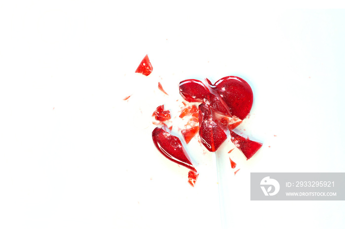 broken heart red lollipop sweet isolated on white background