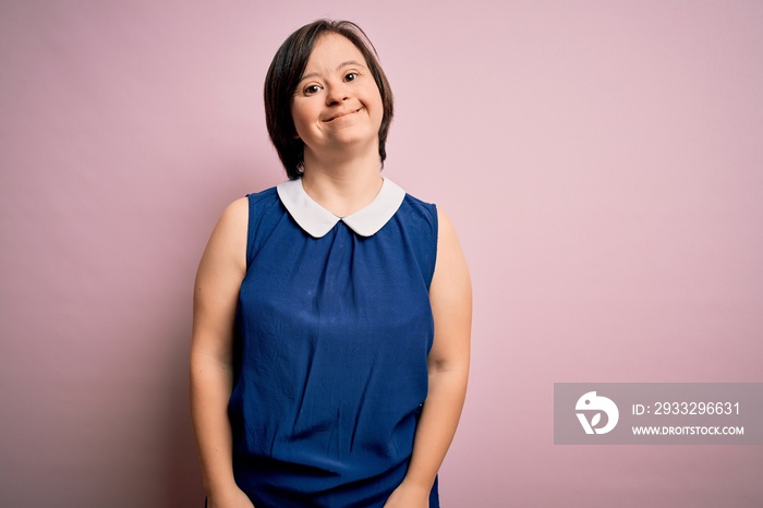 Young down syndrome woman wearing elegant shirt over pink background with a happy and cool smile on 