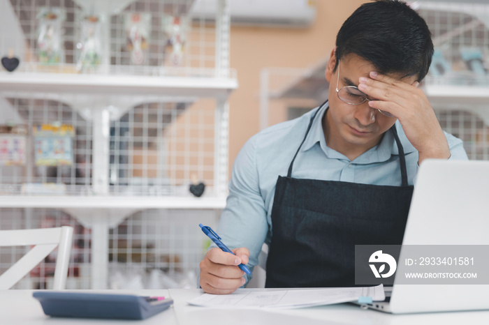 Male entrepreneur store owner feel stressful regret and sad in business crisis during covid pandemic