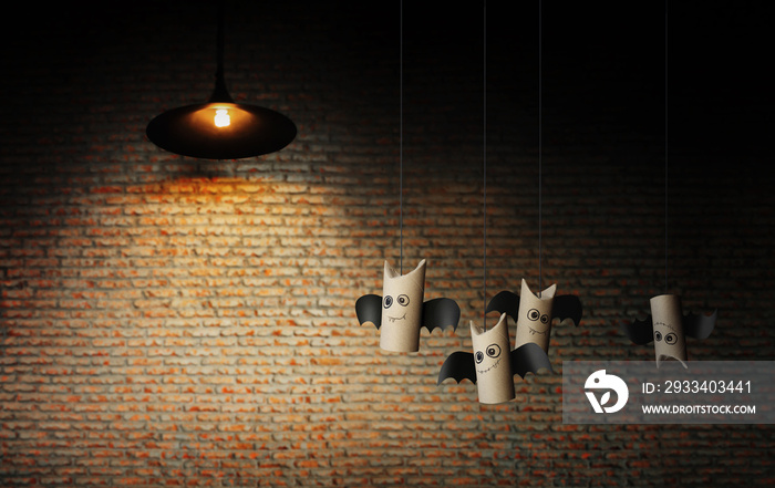 Sweetie bats of Halloween on brick wall. Halloween concept background.