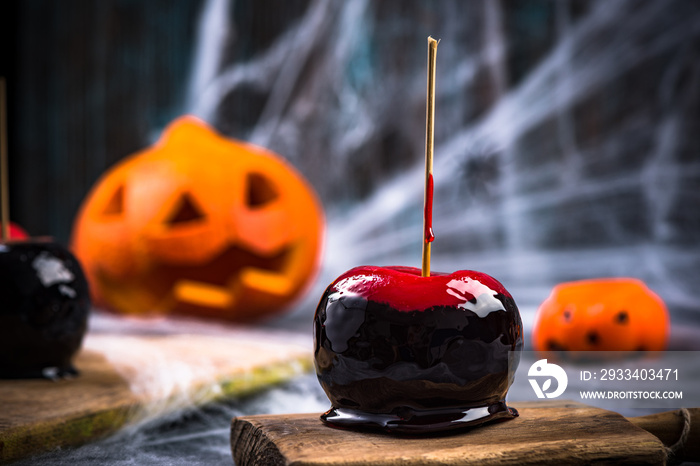 Red and black candy glazed apple, Halloween snack