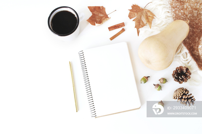 Autumn, fall workspace composition. Notebook mock-up scene. Cup of coffee, wool blanket, autumn leav