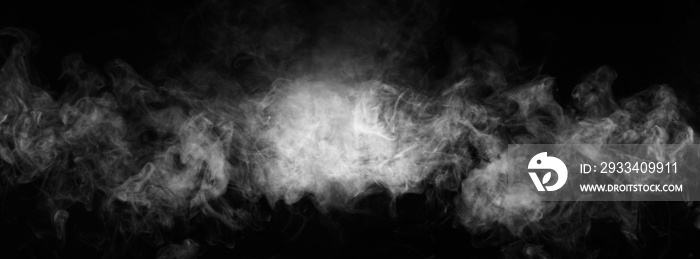 Abstract smoke texture over black. Fog in the darkness.