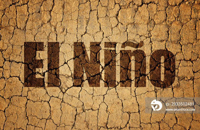 Dry cracked soil with El Niño text. Concept of change climate.