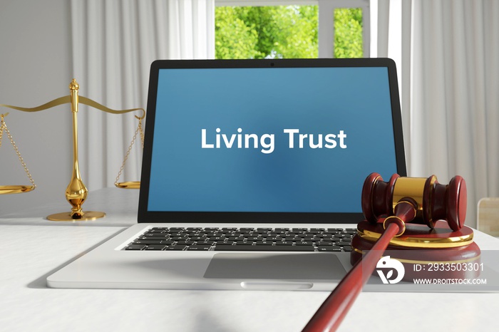 Living Trust – Law, Judgment, Web. Laptop in the office with term on the screen. Hammer, Libra, Lawyer.