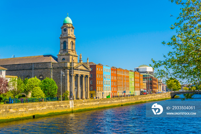 Riverside of Liffey dominated by Saint Paul’s church in Dublin, Ireland