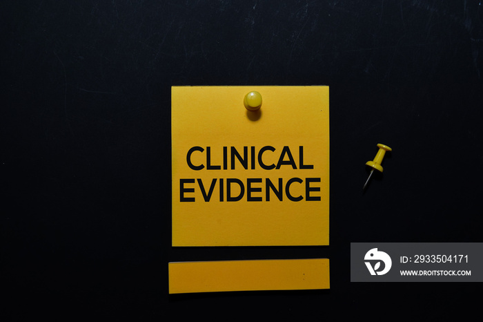 Clinical Evidence write on sticky notes isolated on office desk. medical and education concept.