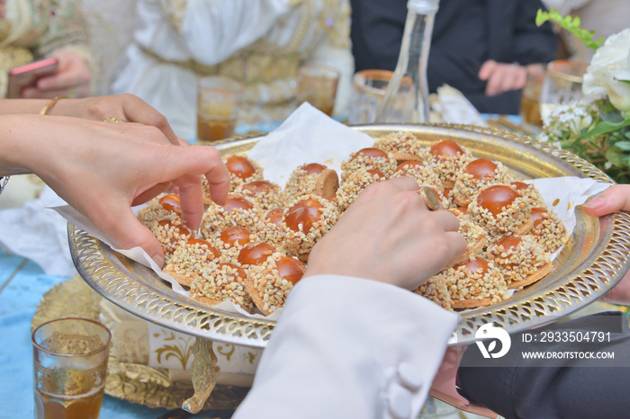 Moroccan sweets. Giving sweets to guests at the wedding