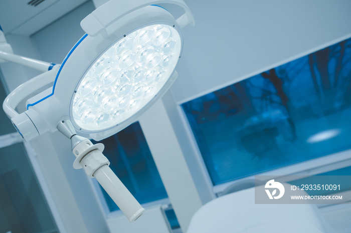 surgical lamps in operation room take with art lighting and blue filter. lighting fixture in a hospital operating room. Coronavirus, virus, operating room, laboratory