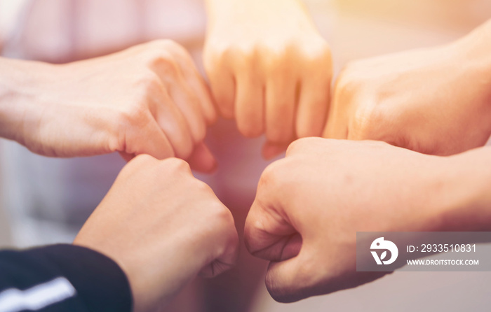 close up of hand people do gestures fist bump after working deal successful together. Charities, friendship, unity and cooperation Concept