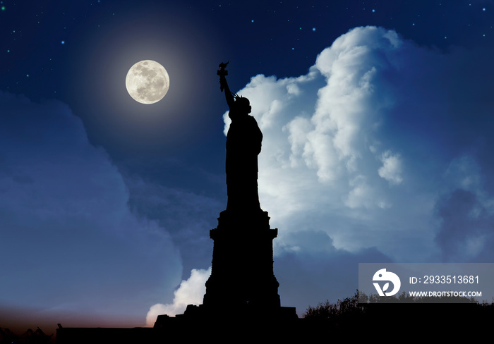 Silhouette of Statue of Liberty over dramatic full moon, New York, USA