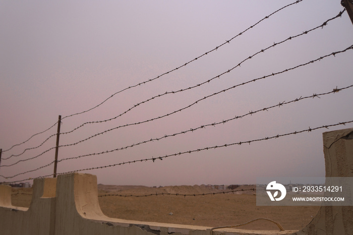 Restrictive fence with barbed wire. Tour area conc camp. Genocide during the war. Stock photo