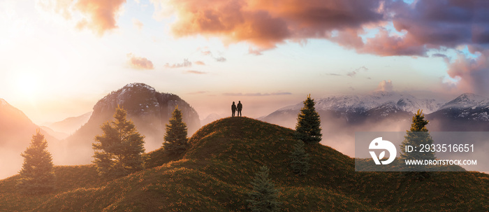 Magical fantasy scene with man and woman couple on top of rock and rocky mountain landscape in background. 3d Rendering. Dramatic Sunset Cloudy Sky. Adventure Concept