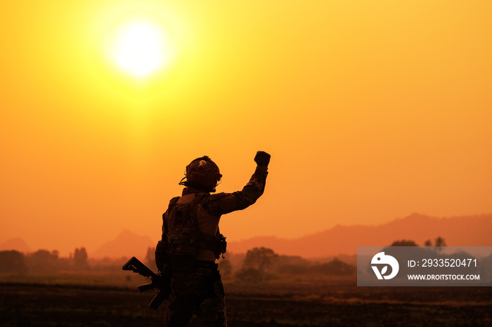 The shadow of the battle of soldiers on the battlefield patrolling at sunset