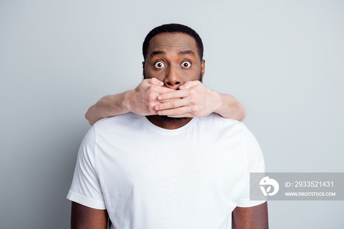 Photo of helpless scared african guy can’t stand unfairly society shut up black citizens white skin arm close his mouth threatening danger lawlessness issue isolated grey color background