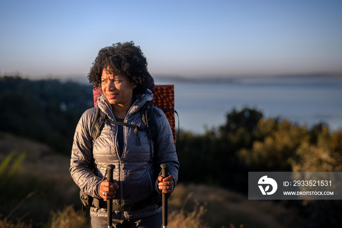 U.S. Army female soldier putting in the miles with an early morning hike in the NorthWest.