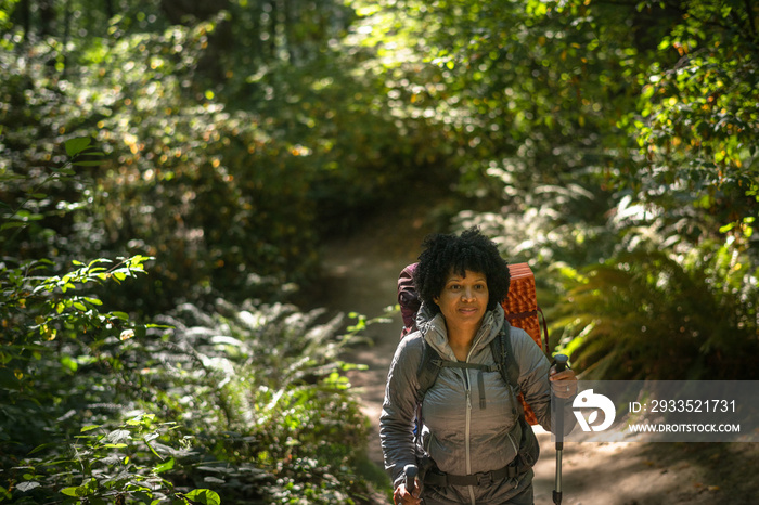 U.S. Army female soldier putting in the miles with an early morning hike in the NorthWest.