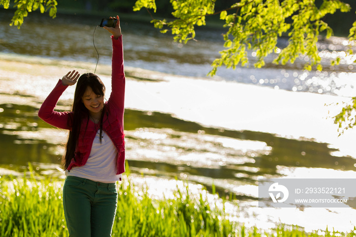 Woman stretching by lake