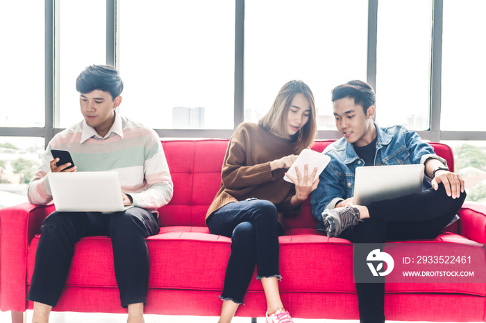 Group of business sitting relax use technology together of smartphone and laptop computer checking social apps and working.Communication concept