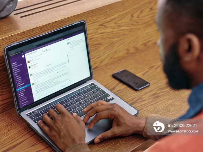 Close-up of businessman using laptop