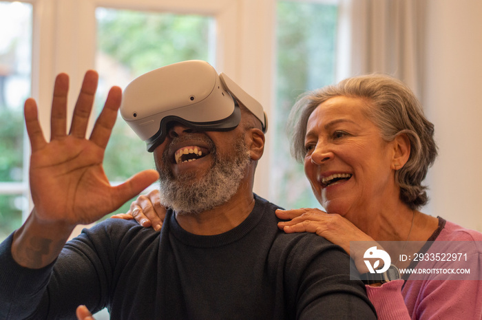 Senior couple having fun with VR set