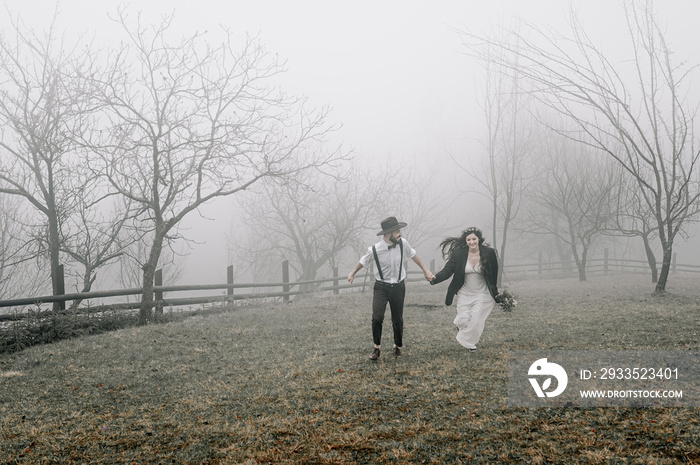 gorgeous bride and stylish groom, boho wedding couple, luxury ceremony at mountains with amazing view, space for text