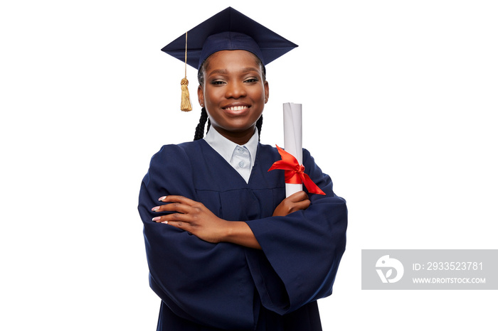 education, graduation and people concept - happy graduate student woman in mortarboard and bachelor gown with diploma over white background