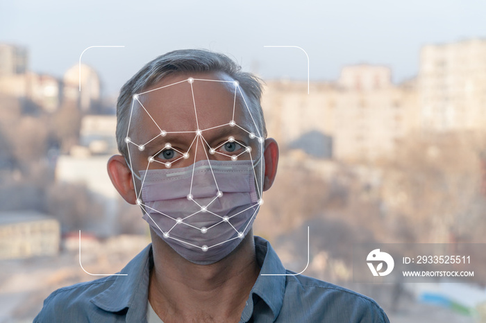 Face Detection. Facial Recognition System Concept. Technological Scanning of Face of man in medical mask for biometric facial recognition