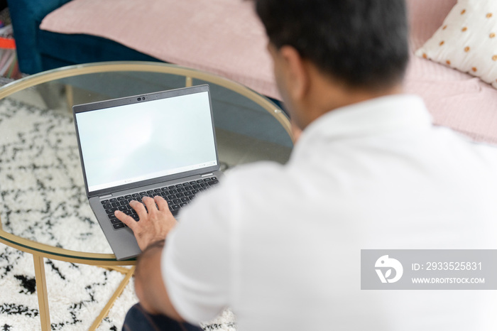 Man using laptop at home