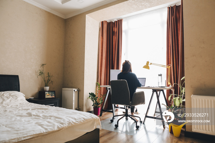 woman working on laptop at home. telework