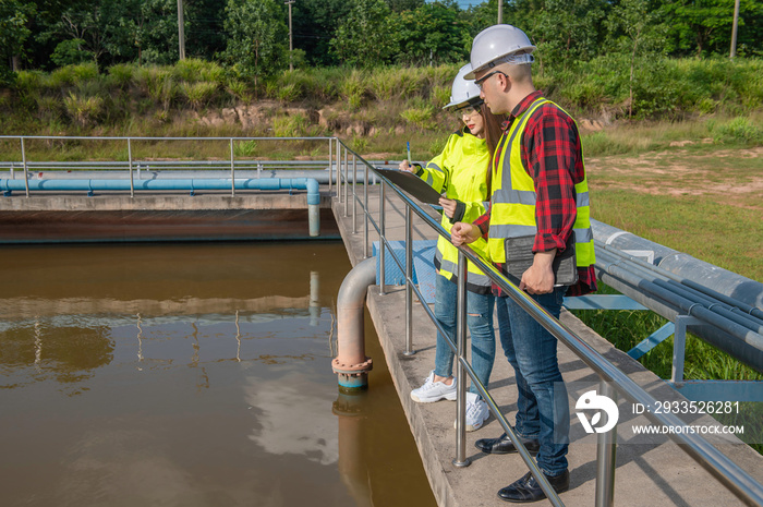 Environmental engineers work at wastewater treatment plants,Water supply engineering working at Water recycling plant for reuse,Technicians and engineers discuss work together.