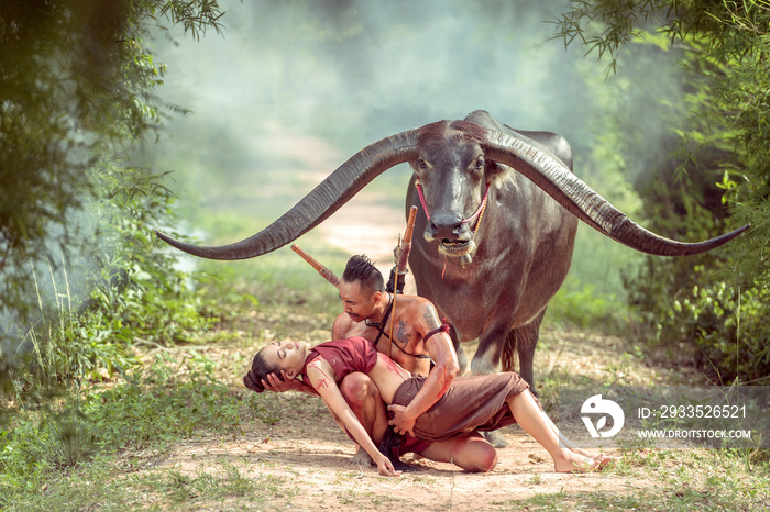 thai ancient warrior holding a two-handed sword and long horn buffalo